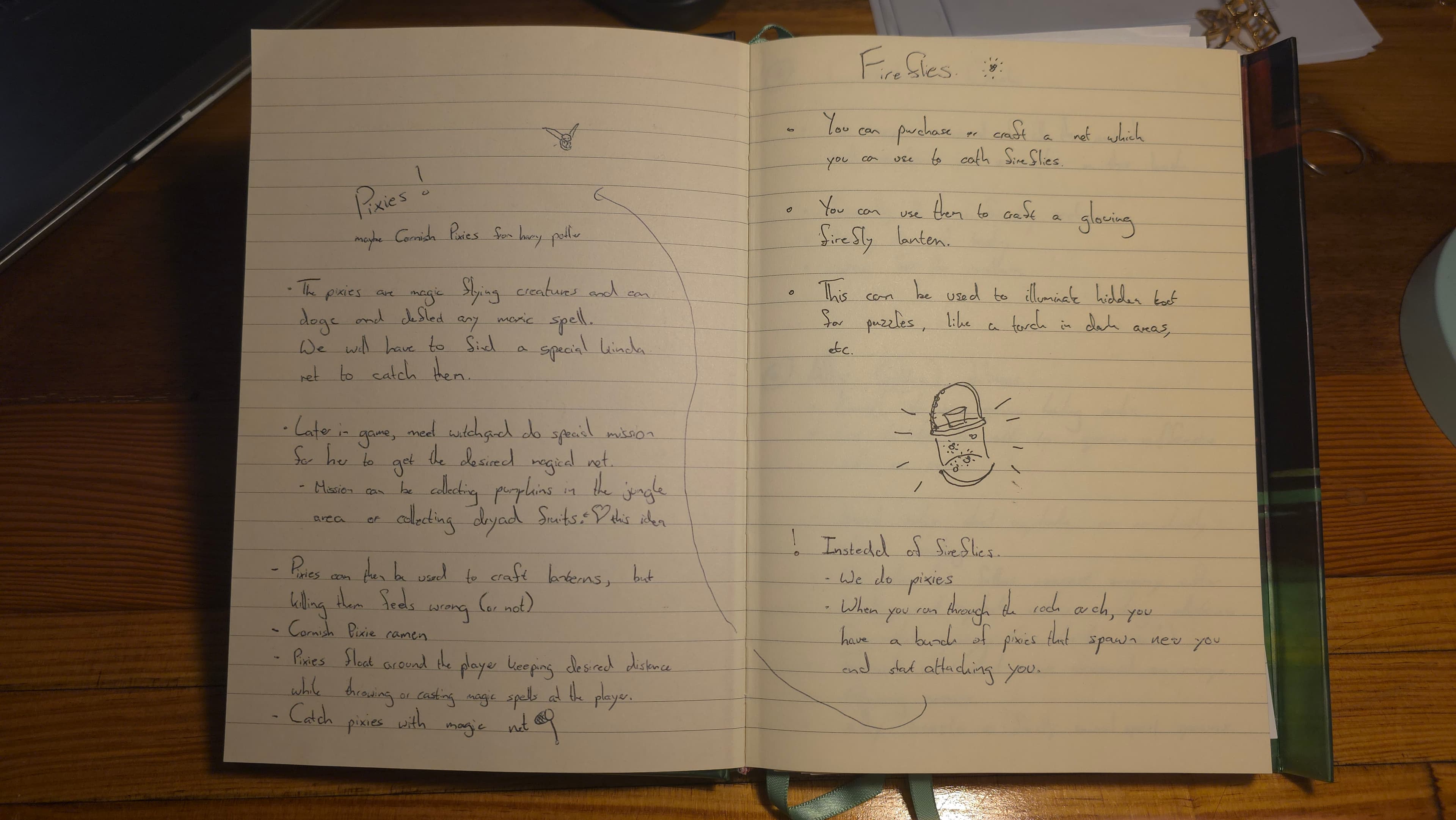 Open development notebook with handwritten pixie and firefly mechanic ideas